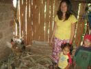 This young family has been given four hens and a cockerel