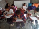 Kids studying in partially finished classroom
