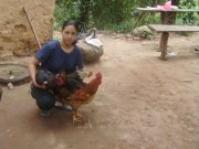 A picture of woman and her new chickens