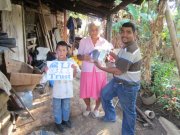 A picture of a family receiving a food bag