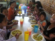 A picture of school children enjoying a Christmas meal