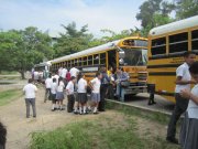 A picture of children getting ready to go on a school trip