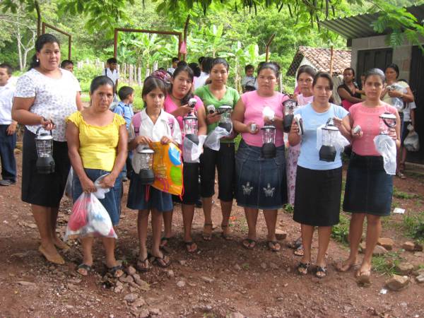 People of all ages receiving their lamps and torches